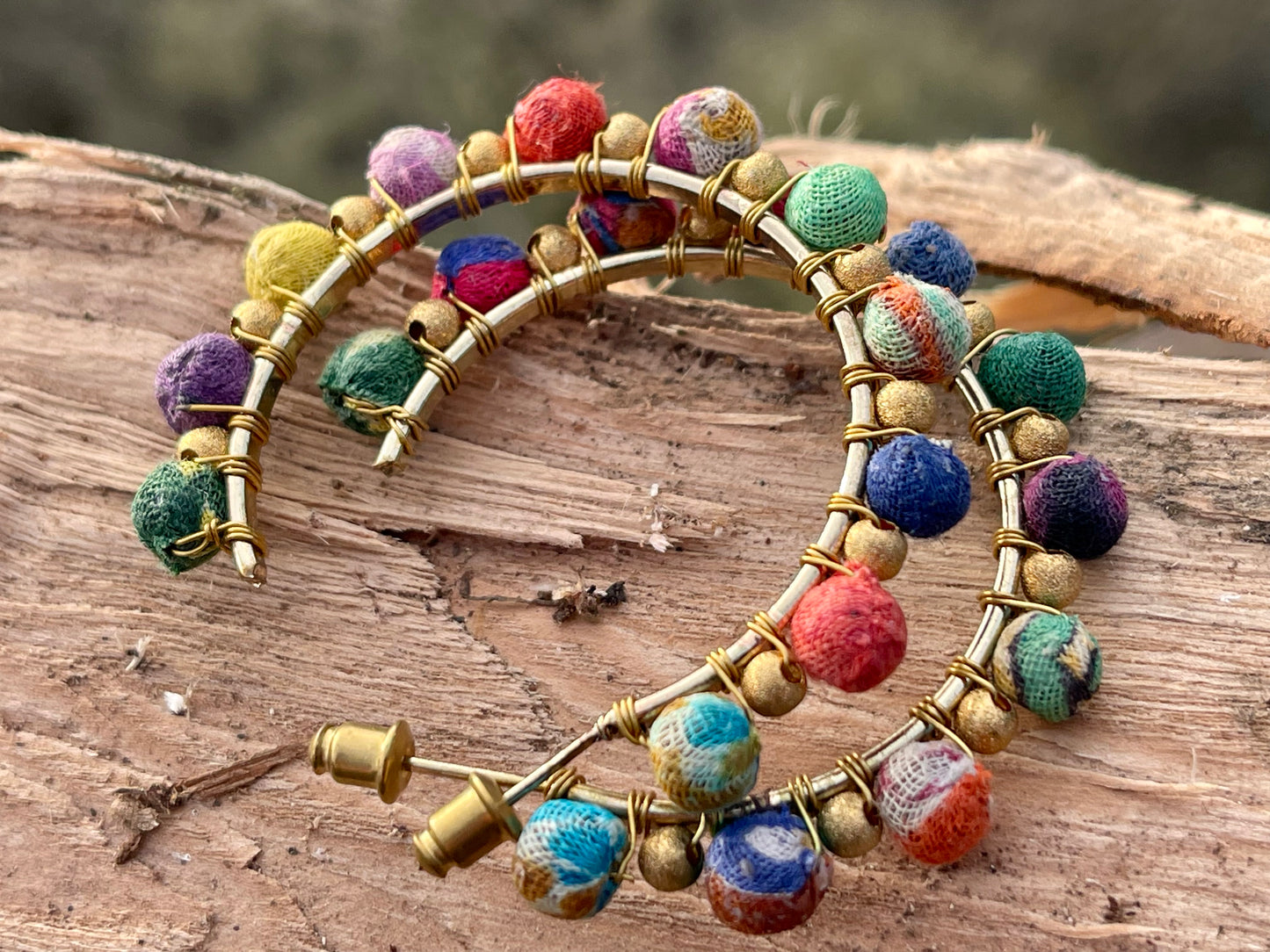 Handmade earrings made from waste textiles