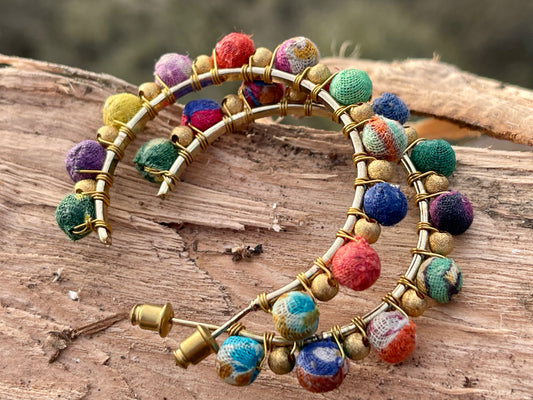 Handmade earrings made from waste textiles