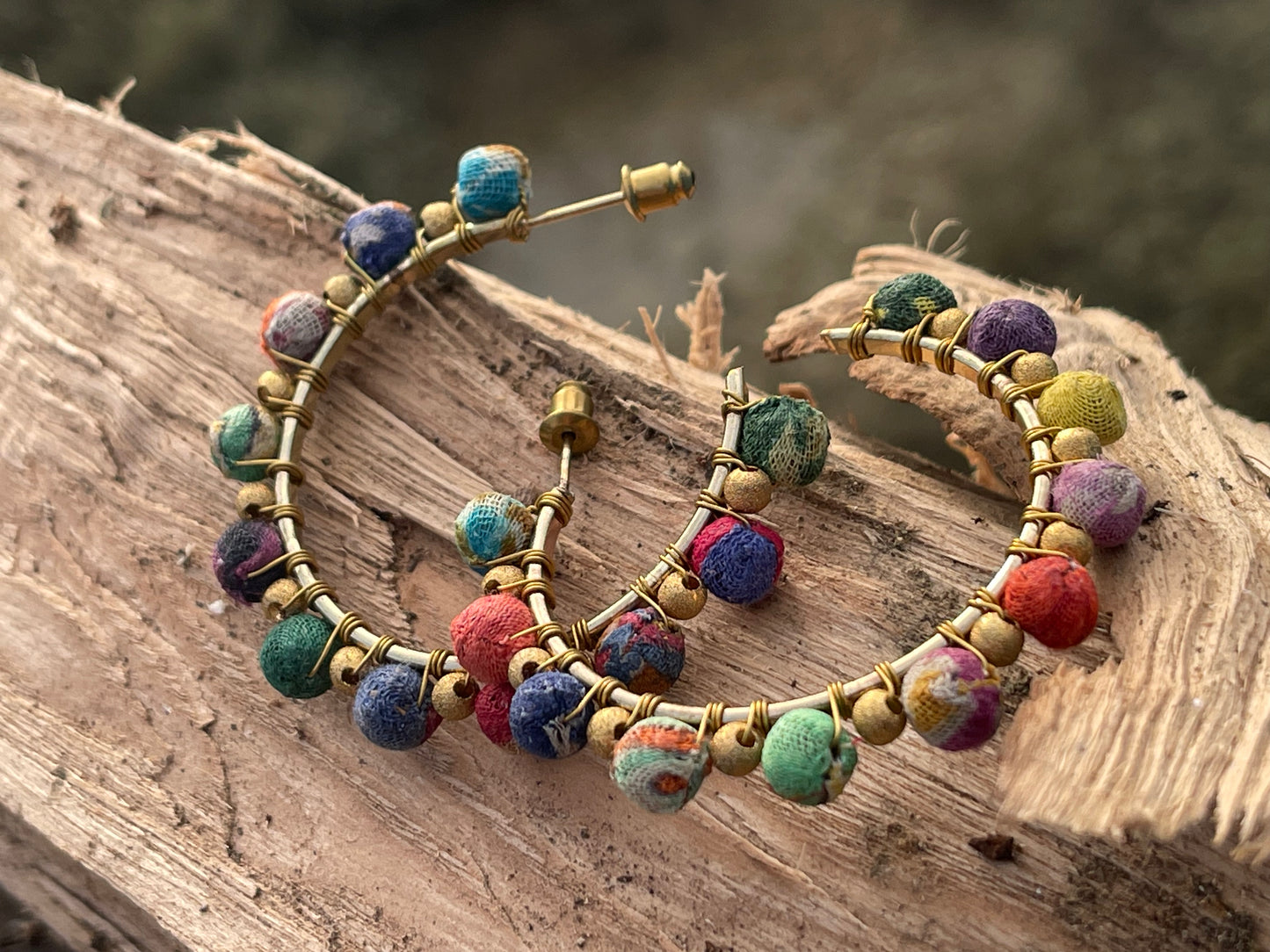 Handmade earrings made from waste textiles