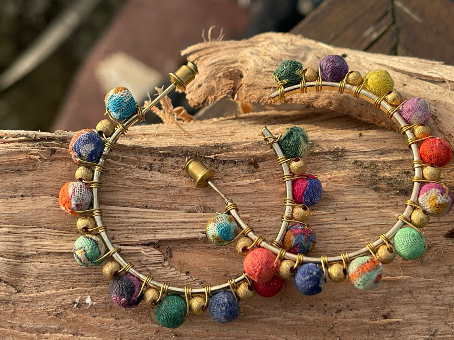 Handmade earrings made from waste textiles