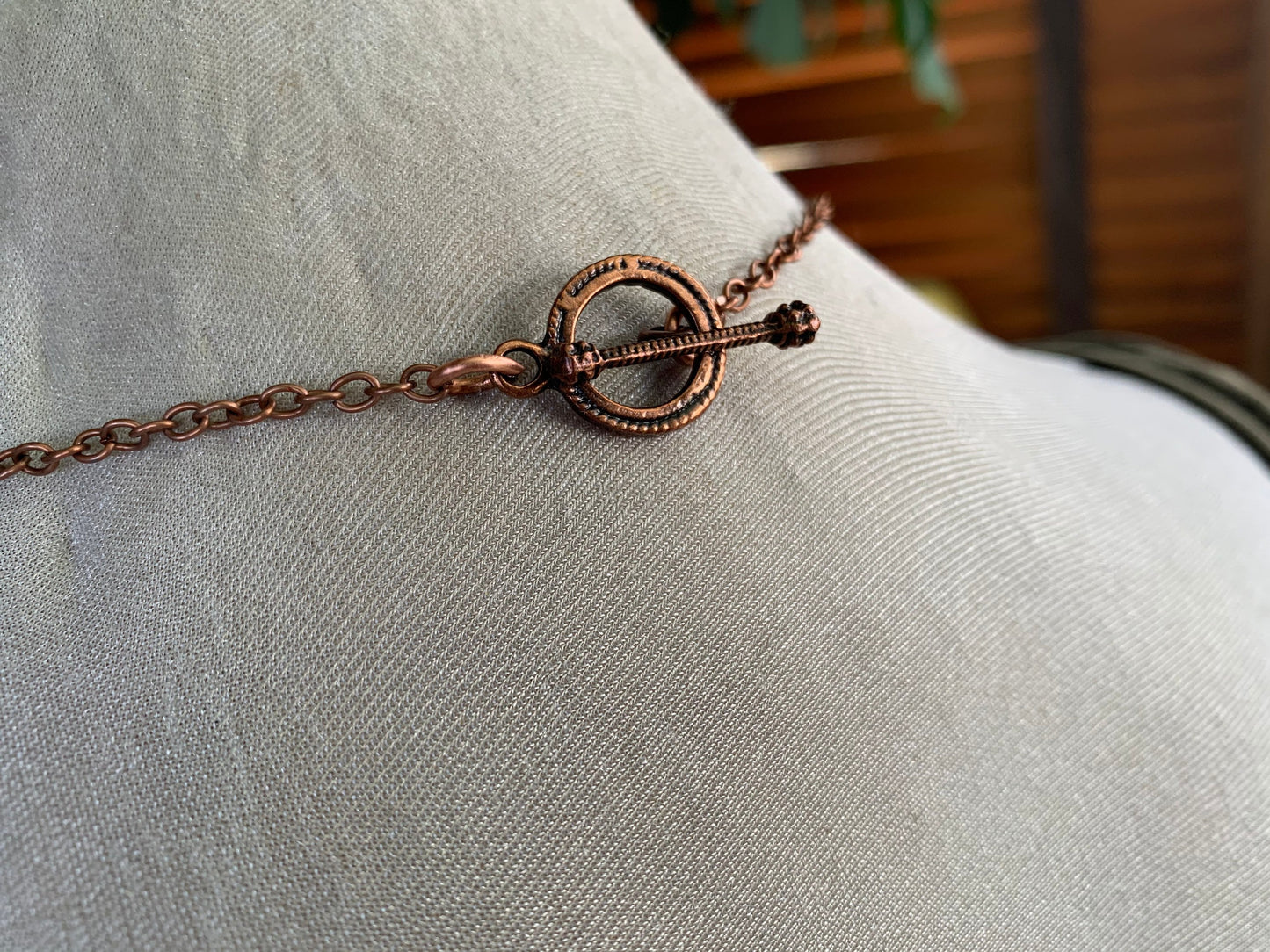 Eco friendly handmade necklace made from sea glass and naturally weathered recycled copper. Ethical jewellery. Unique handmade jewellery.