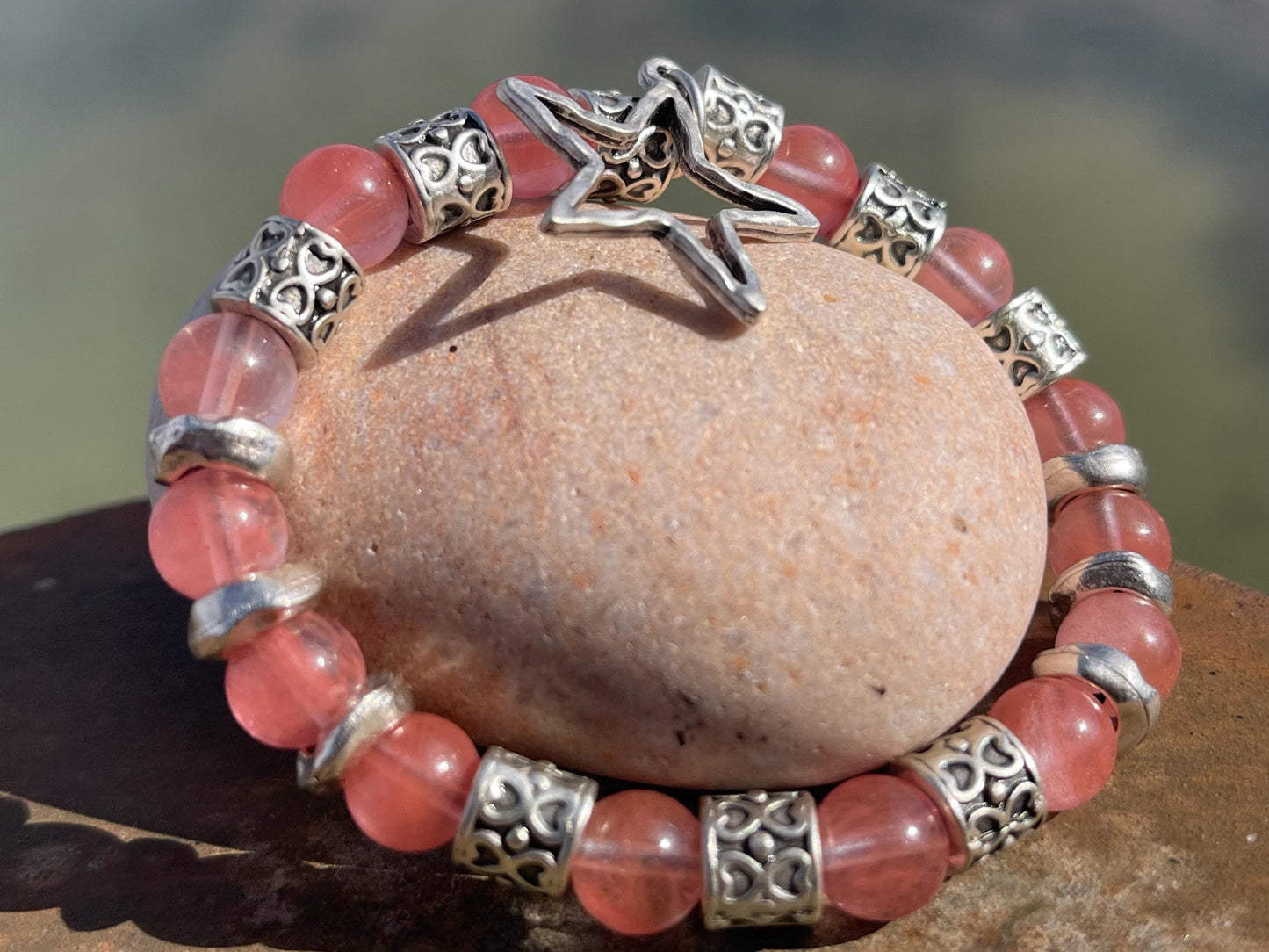 Strawberry quartz bracelet showcasing a silver star. Star jewellery, ethical jewellery, handmade pink bracelet. Congratulations gift.
