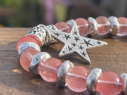 Strawberry quartz bracelet showcasing a silver star. Star jewellery, ethical jewellery, handmade pink bracelet. Congratulations gift.