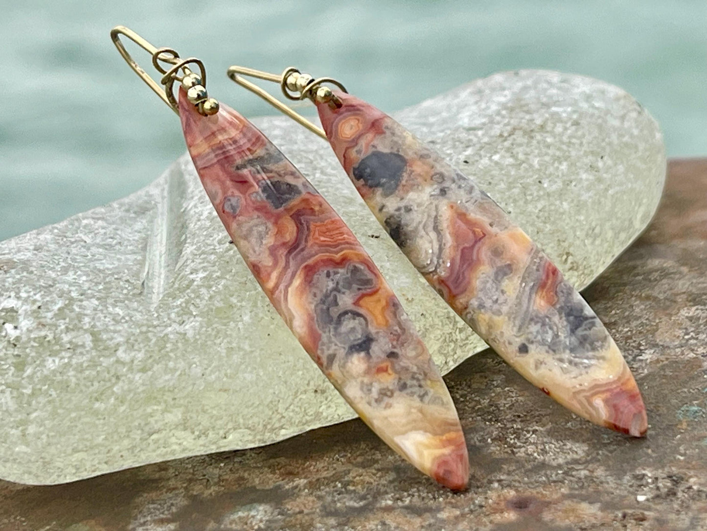 Orange gemstone earrings on recycled sterling silver. Long drop dangly earrings. Unusual orange jewellery. Earthy and ethical jewellery.