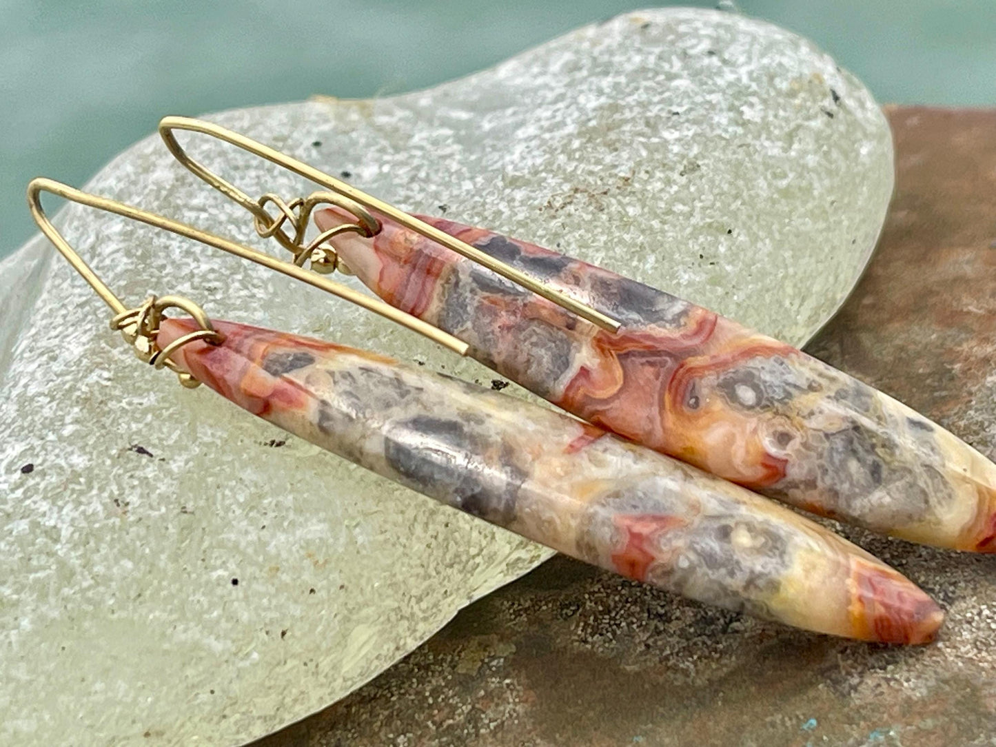 Orange gemstone earrings on recycled sterling silver. Long drop dangly earrings. Unusual orange jewellery. Earthy and ethical jewellery.