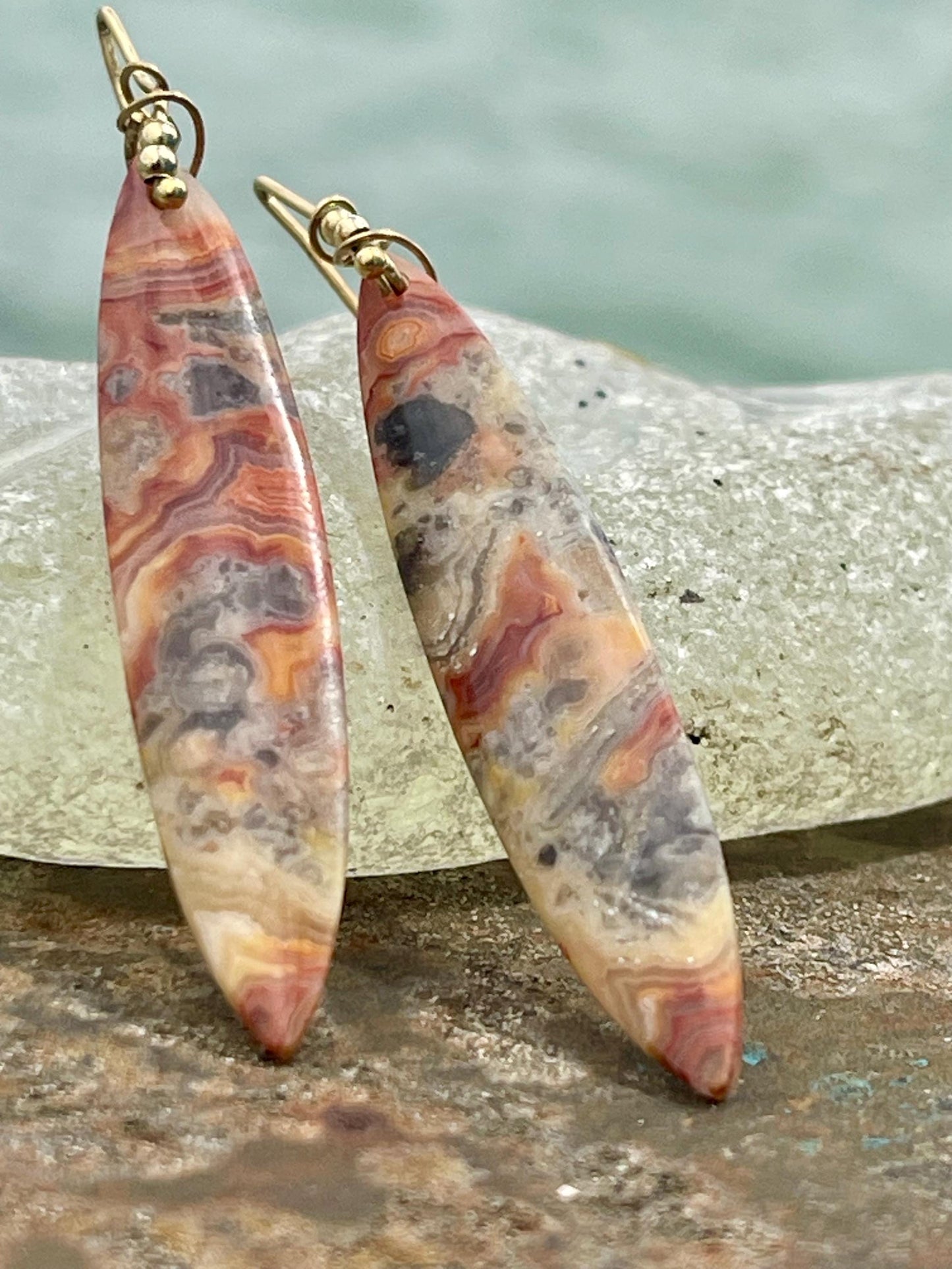 Orange gemstone earrings on recycled sterling silver. Long drop dangly earrings. Unusual orange jewellery. Earthy and ethical jewellery.