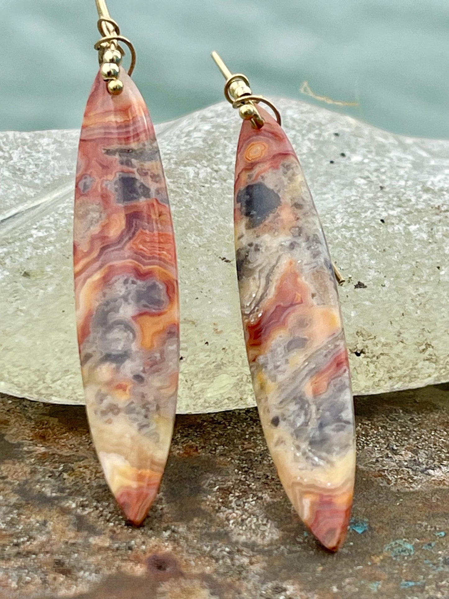Orange gemstone earrings on recycled sterling silver. Long drop dangly earrings. Unusual orange jewellery. Earthy and ethical jewellery.