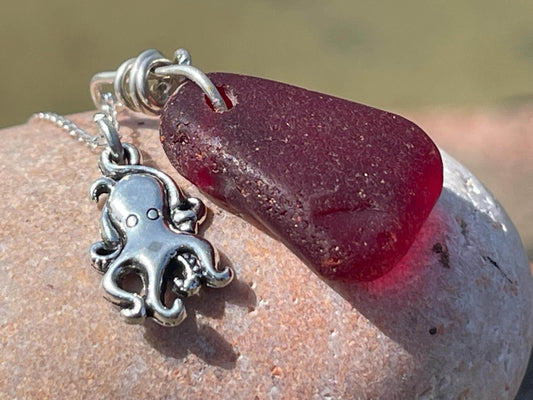 Eco friendly sea glass necklace on a sterling silver chain showcasing a little octopus pendant, octopus  necklace, ethical jewellery