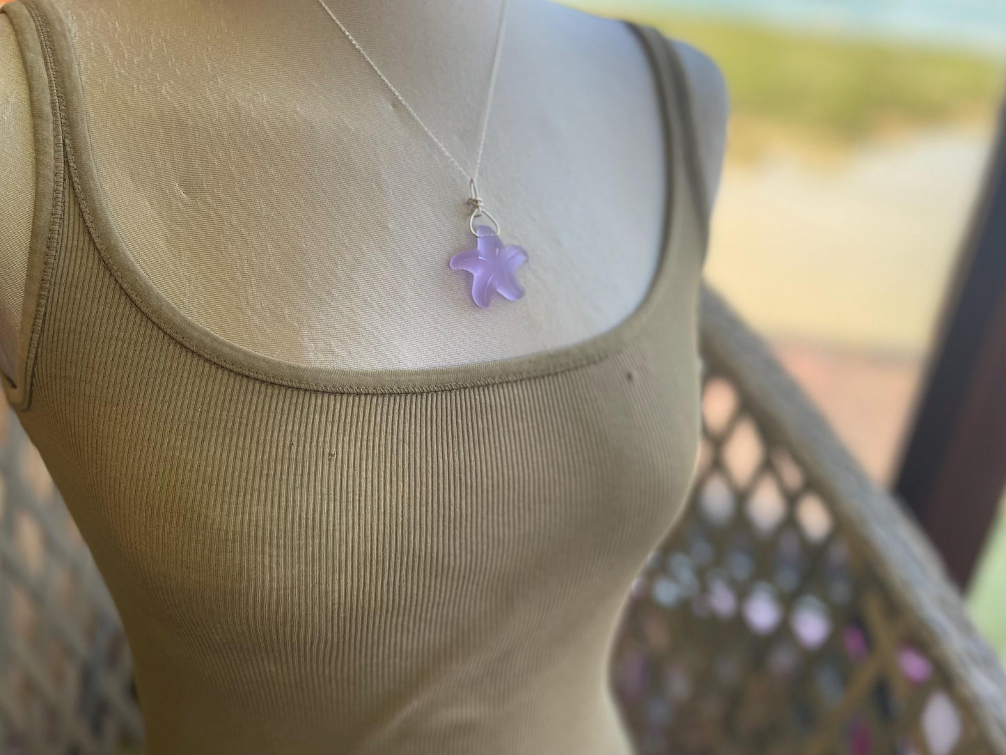 Eco friendly glass necklace on a sterling silver chain showcasing a pink starfish pendant, starfish  necklace, ethical jewellery