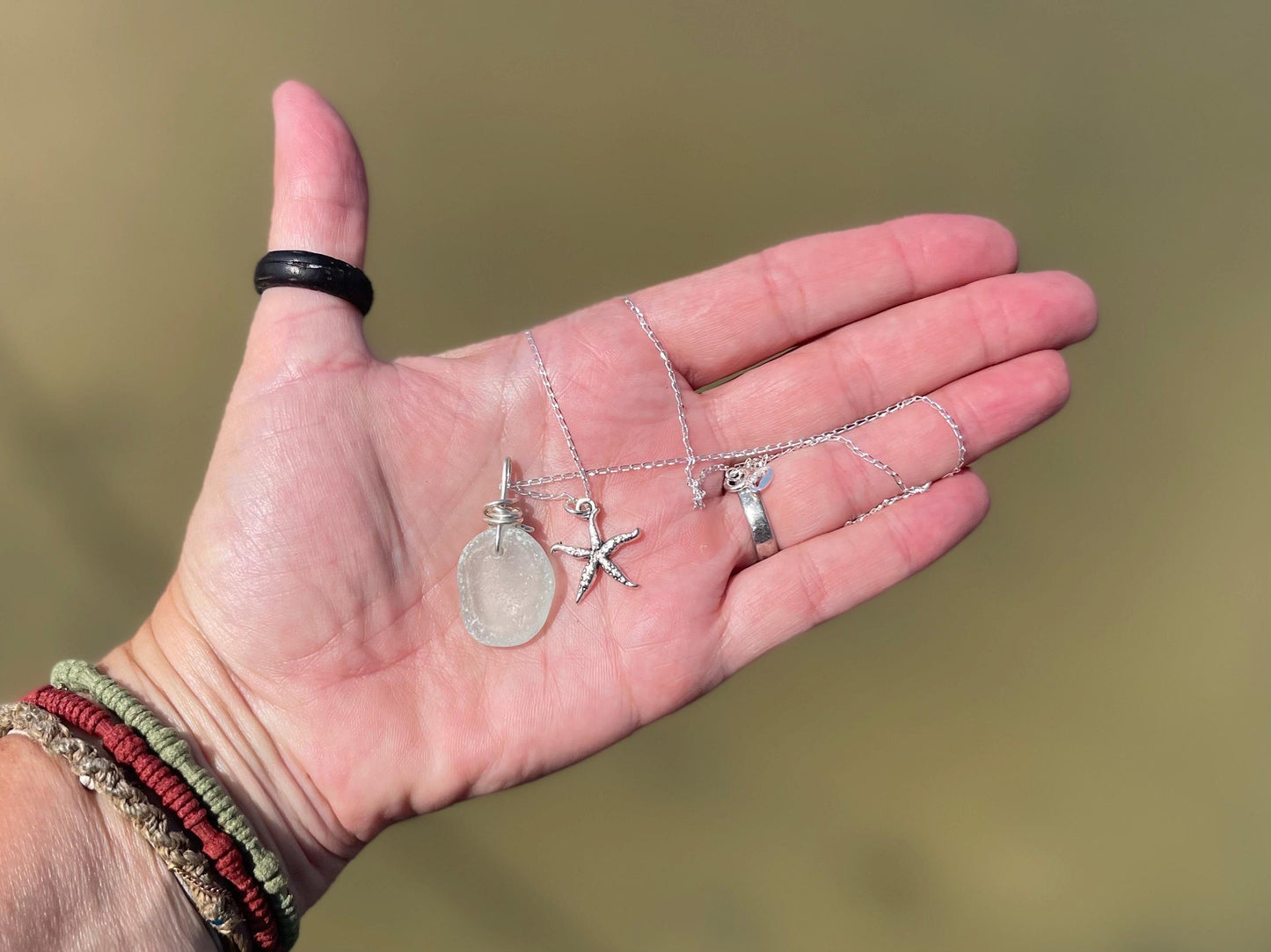 Eco friendly sea glass necklace on a sterling silver chain showcasing a little starfish pendant, starfish  necklace, ethical jewellery