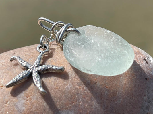 Eco friendly sea glass necklace on a sterling silver chain showcasing a little starfish pendant, starfish  necklace, ethical jewellery