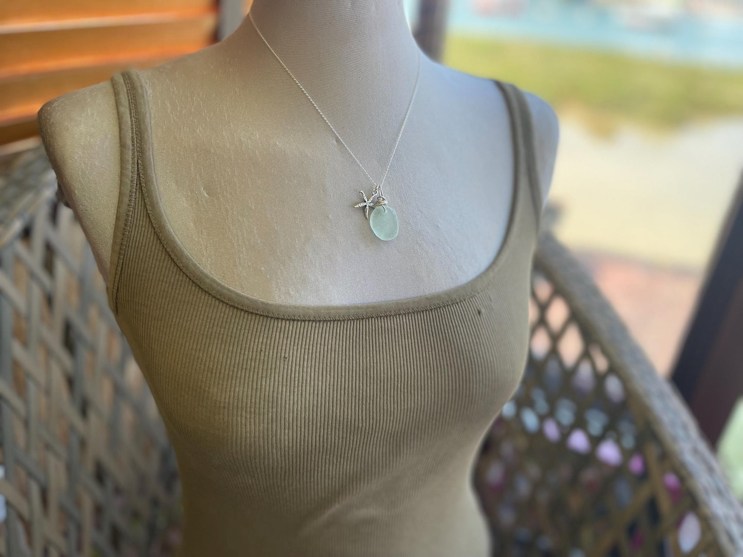 Eco friendly sea glass necklace on a sterling silver chain showcasing a little starfish pendant, starfish  necklace, ethical jewellery