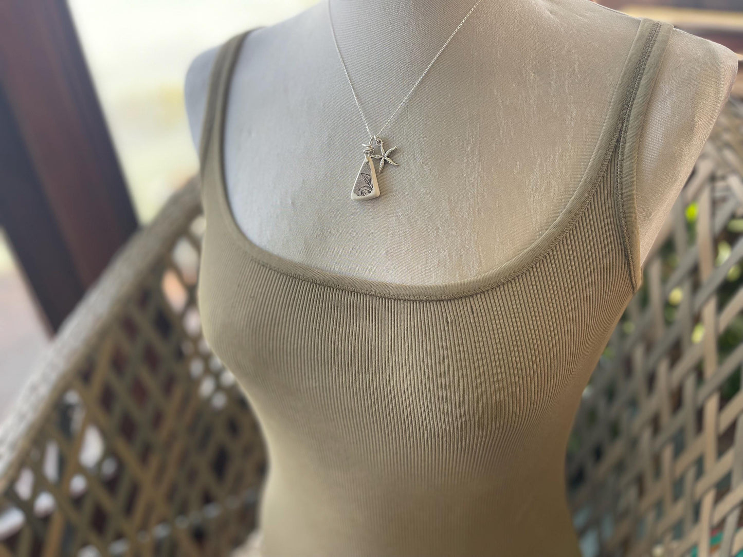 Eco friendly sea ceramic necklace on a sterling silver chain showcasing a little starfish pendant, starfish necklace, ethical jewellery