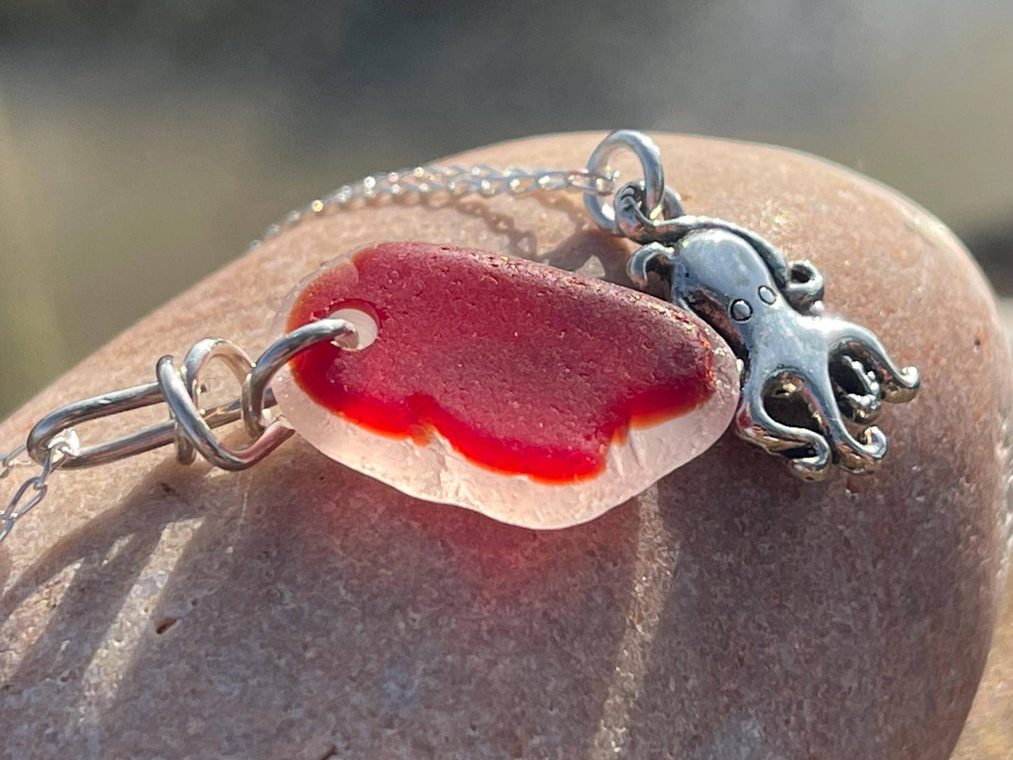 Eco friendly sea glass necklace on a sterling silver chain showcasing a little octopus. Octopus pendant, octopus necklace, ethical jewellery