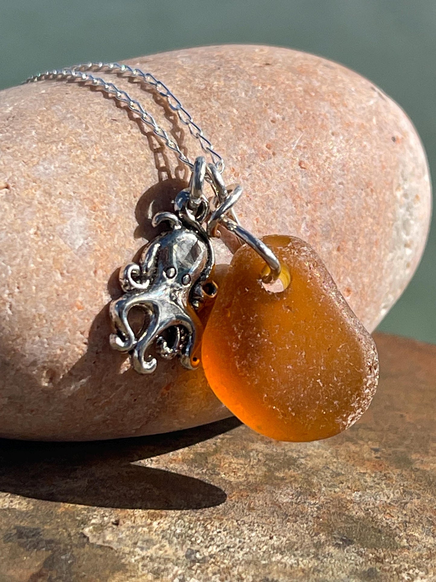 Eco friendly sea glass necklace on a sterling silver chain showcasing a little octopus. Octopus pendant, octopus necklace, ethical jewellery