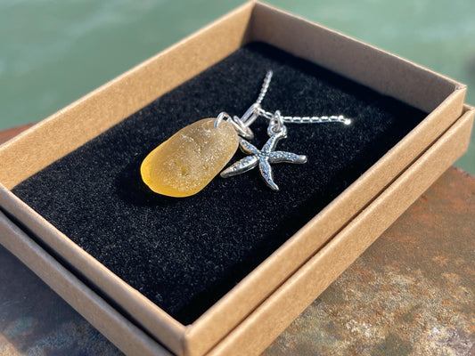 Eco friendly sea glass necklace on a sterling silver chain showcasing a little starfis. Starfish pendant, octopus necklace, eco jewellery