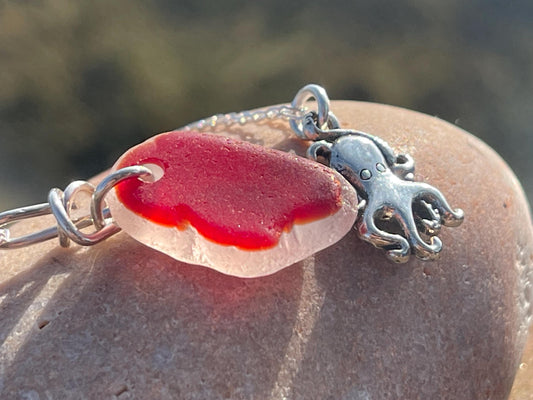 Eco friendly sea glass necklace on a sterling silver chain showcasing a little octopus. Octopus pendant, octopus necklace, ethical jewellery