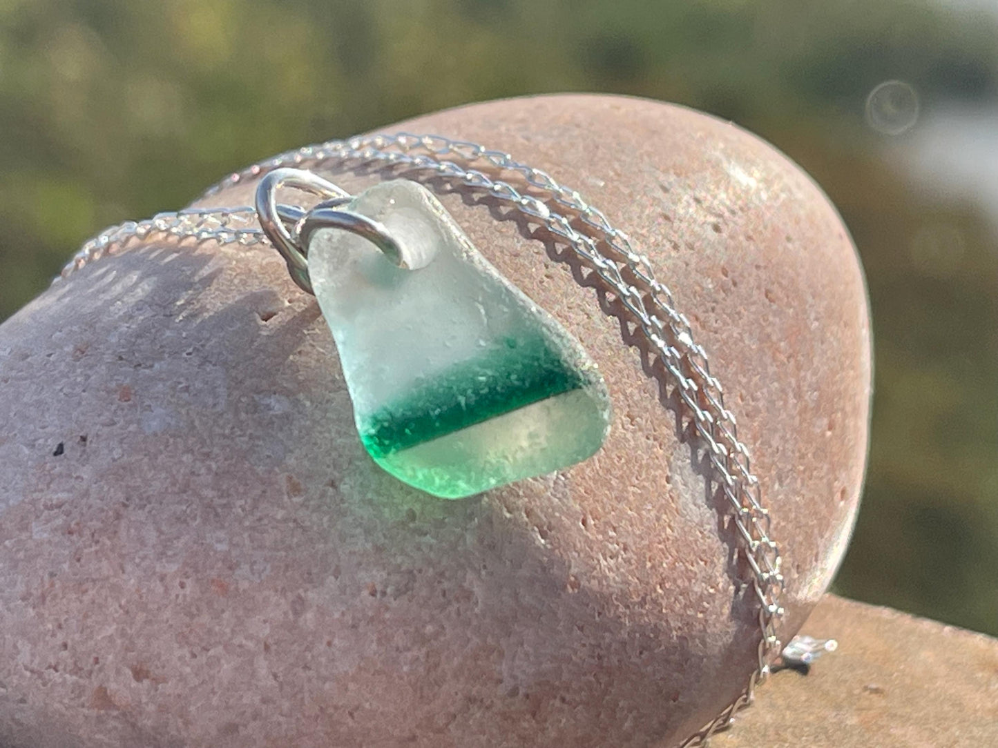 Eco friendly sea glass necklace on a sterling silver chain. Unusual sea glass pendant. Handmade eco friendly jewellery. Ethical jewellery.