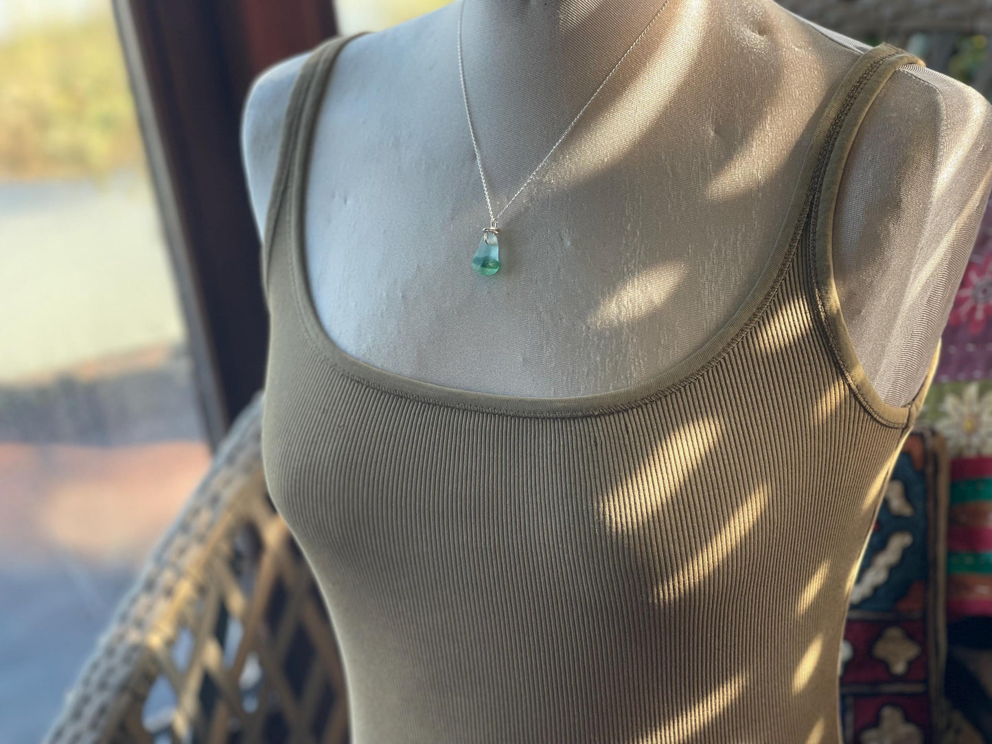 Eco friendly sea glass necklace on a sterling silver chain. Unusual sea glass pendant. Handmade eco friendly jewellery. Ethical jewellery.