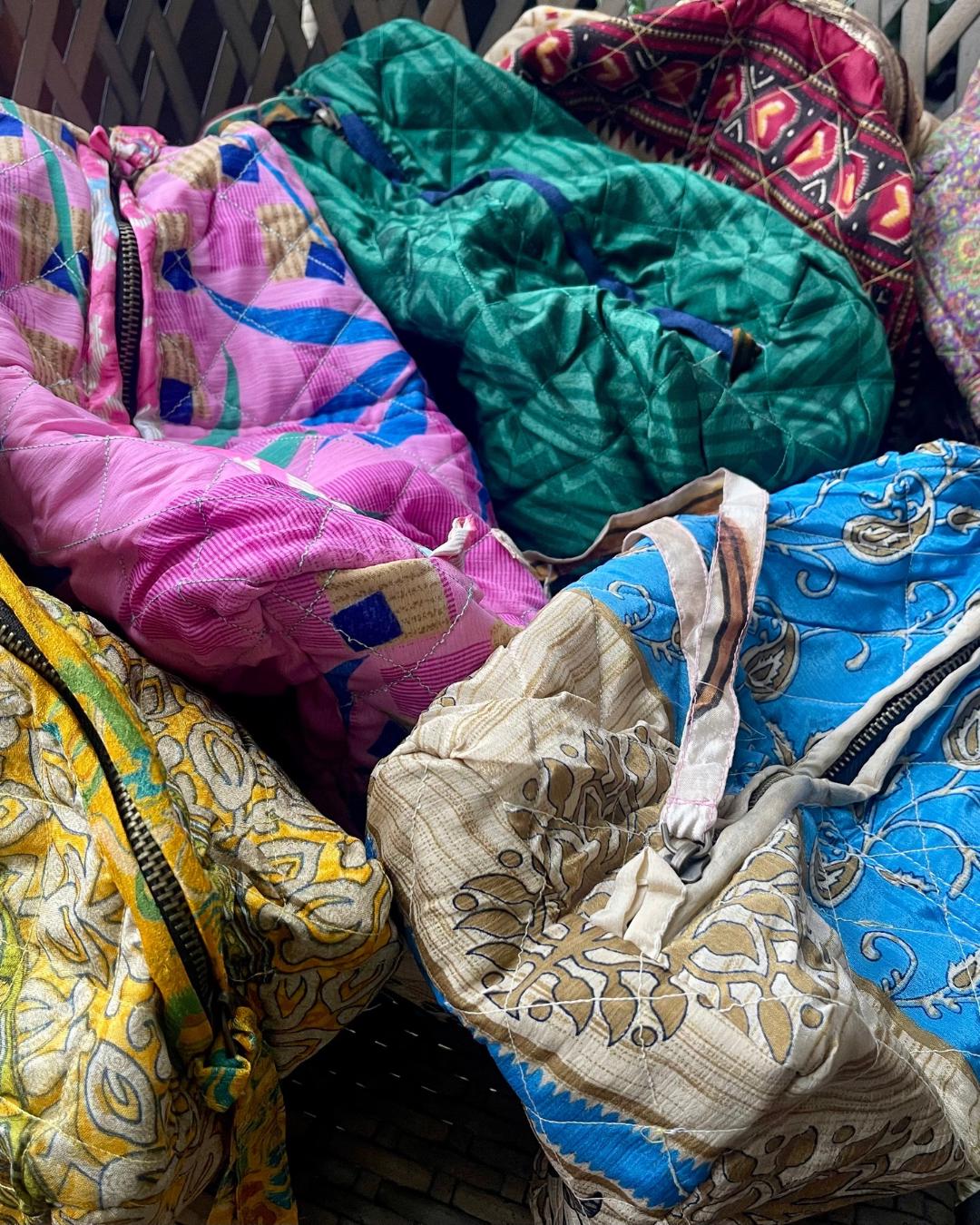 Large zip up recycled wash bag with 4 internal pockets. Wide range of colours. Made from recycled saris. Eco friendly wash bags.