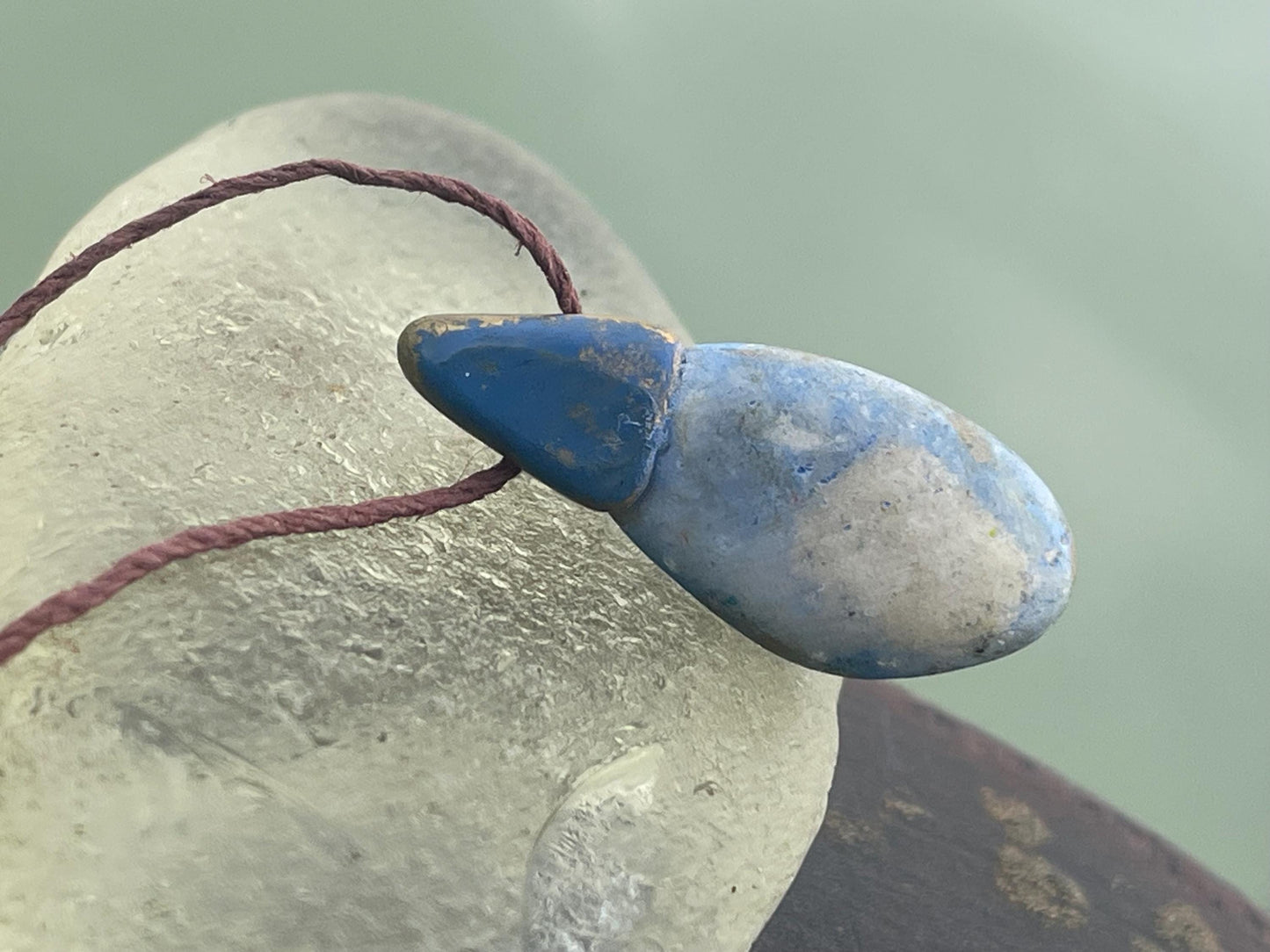 Pebble pendants. Painted pebble necklaces. Hand painted eco friendly necklaces. Eco friendly jewellery. Ethical handmade jewellery.