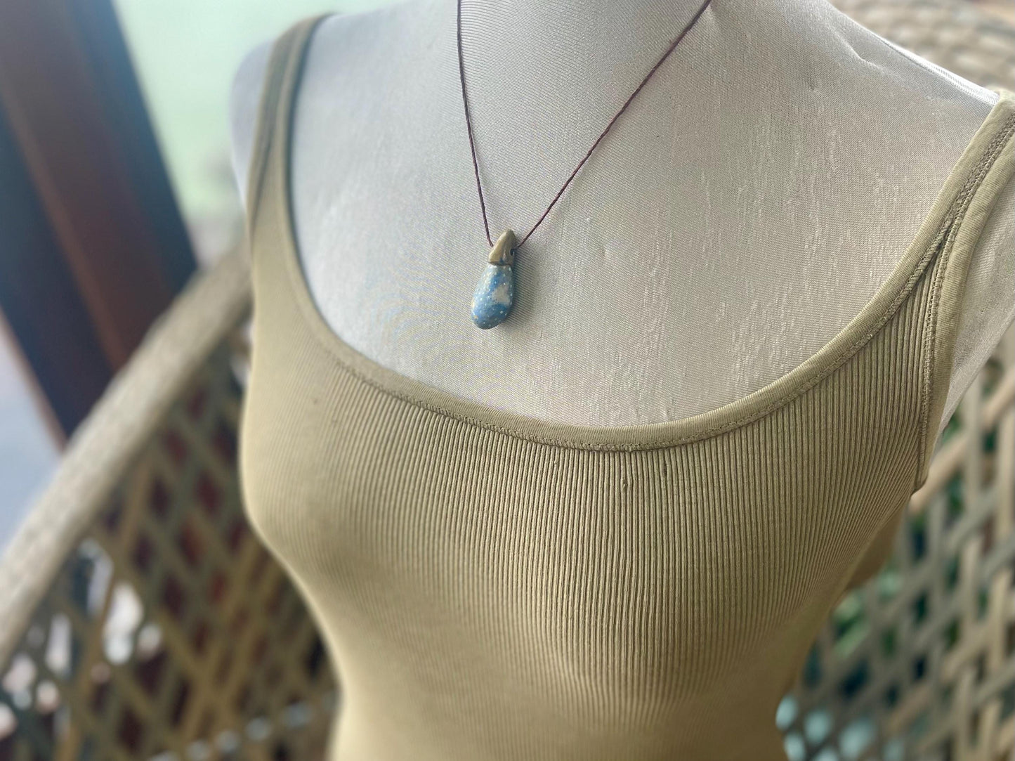 Pebble pendants. Painted pebble necklaces. Hand painted eco friendly necklaces. Eco friendly jewellery. Ethical handmade jewellery.