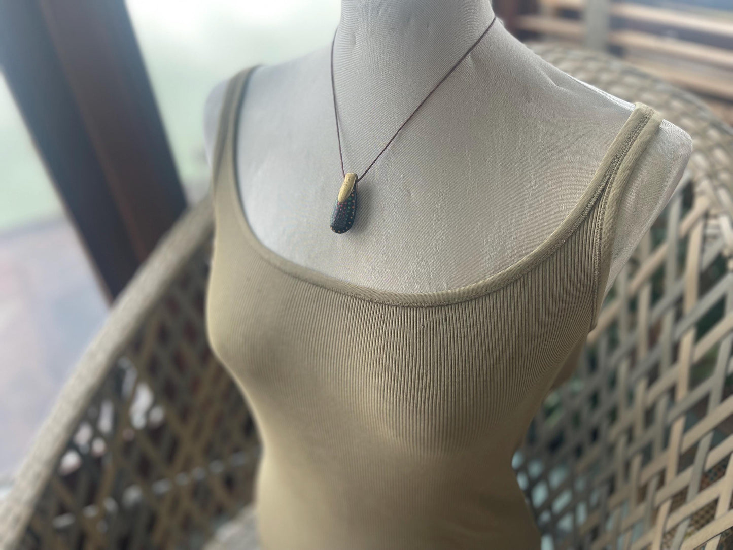 Pebble pendants. Painted pebble necklaces. Hand painted eco friendly necklaces. Eco friendly jewellery. Ethical handmade jewellery.