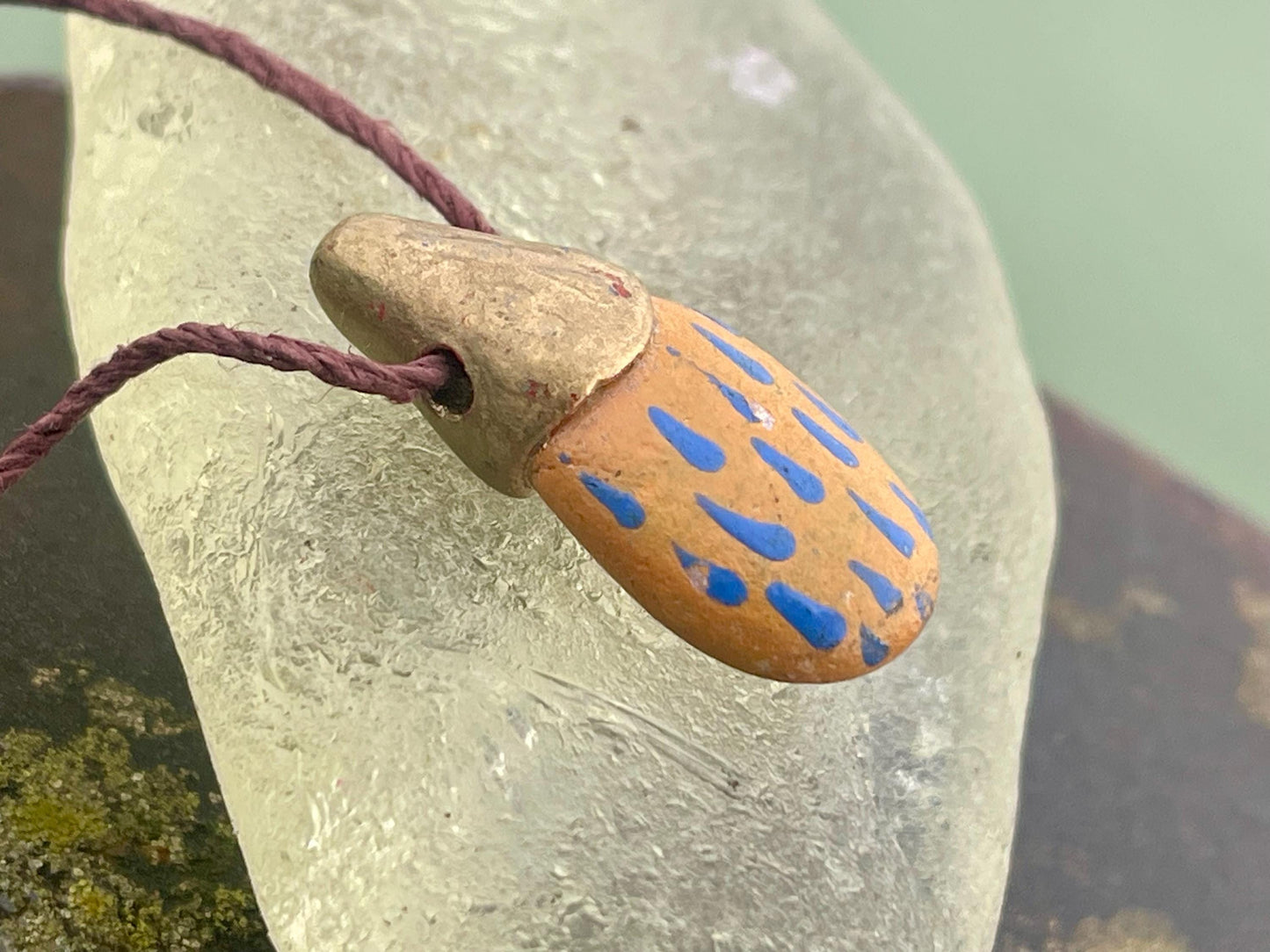 Pebble pendants. Painted pebble necklaces. Hand painted eco friendly necklaces. Eco friendly jewellery. Ethical handmade jewellery.
