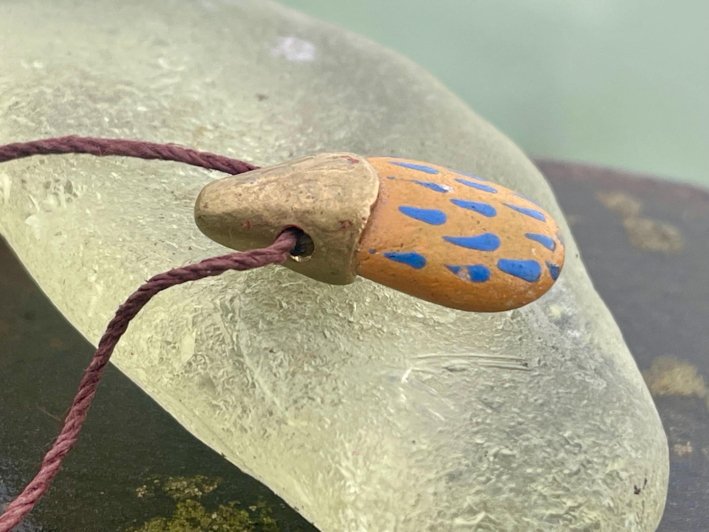 Pebble pendants. Painted pebble necklaces. Hand painted eco friendly necklaces. Eco friendly jewellery. Ethical handmade jewellery.