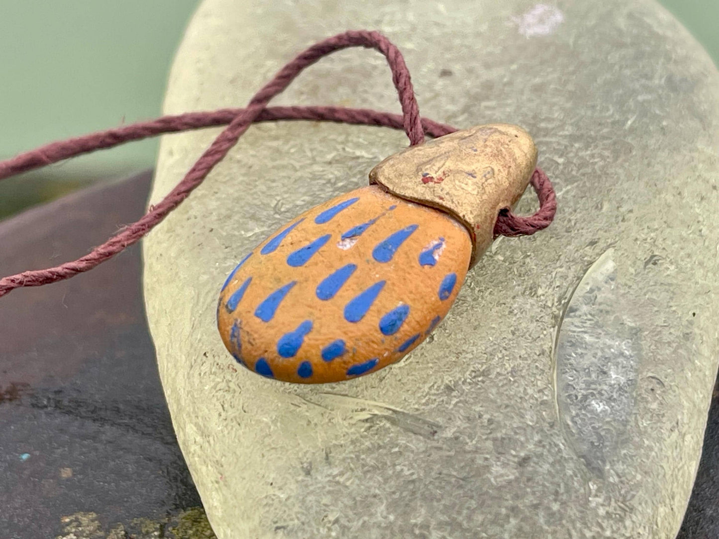 Pebble pendants. Painted pebble necklaces. Hand painted eco friendly necklaces. Eco friendly jewellery. Ethical handmade jewellery.
