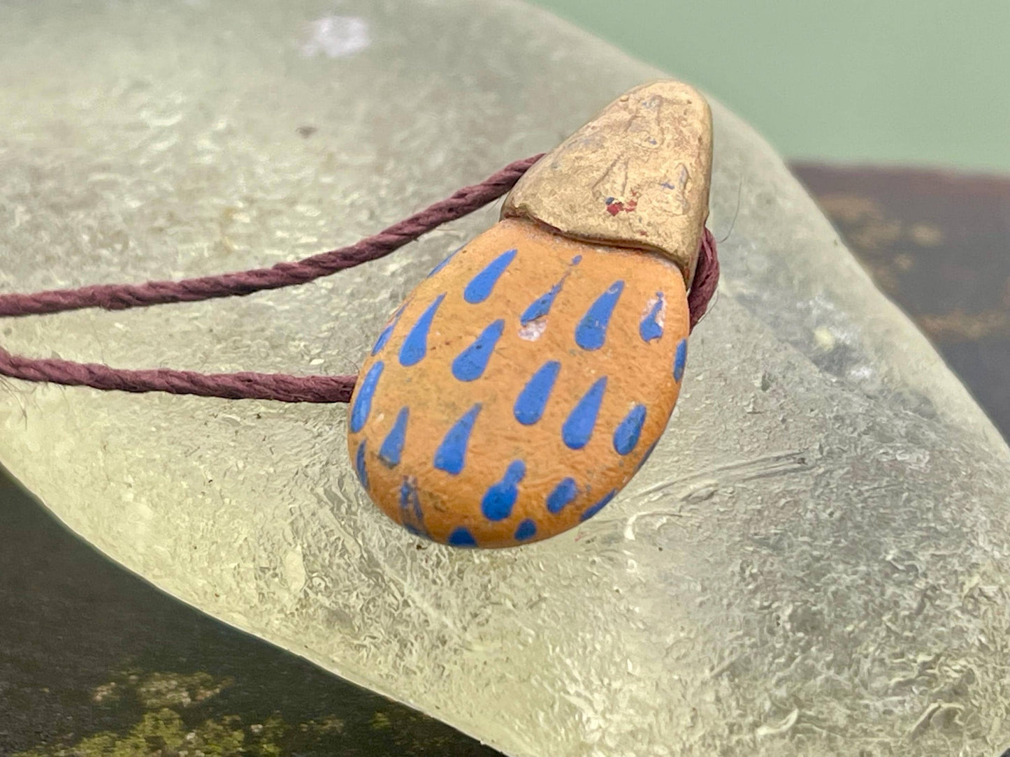 Pebble pendants. Painted pebble necklaces. Hand painted eco friendly necklaces. Eco friendly jewellery. Ethical handmade jewellery.