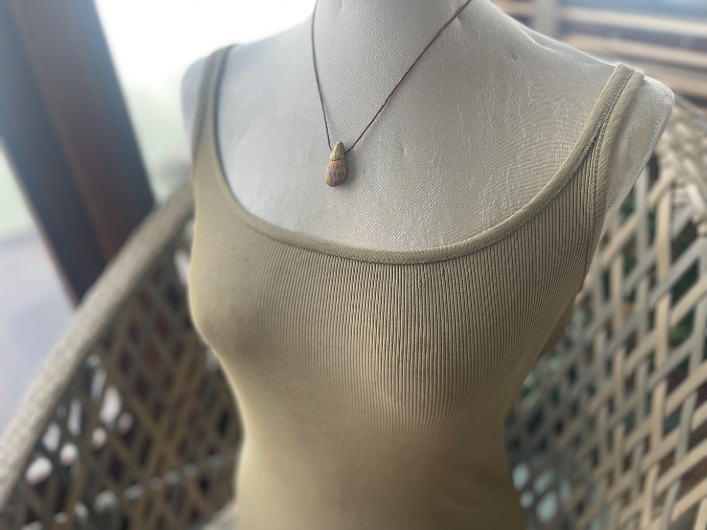 Pebble pendants. Painted pebble necklaces. Hand painted eco friendly necklaces. Eco friendly jewellery. Ethical handmade jewellery.