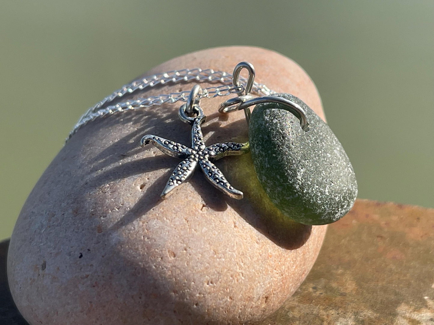 Eco friendly sea glass necklace on a sterling silver chain showcasing a little starfish. Starfish pendant,  eco friendly jewellery. Boho