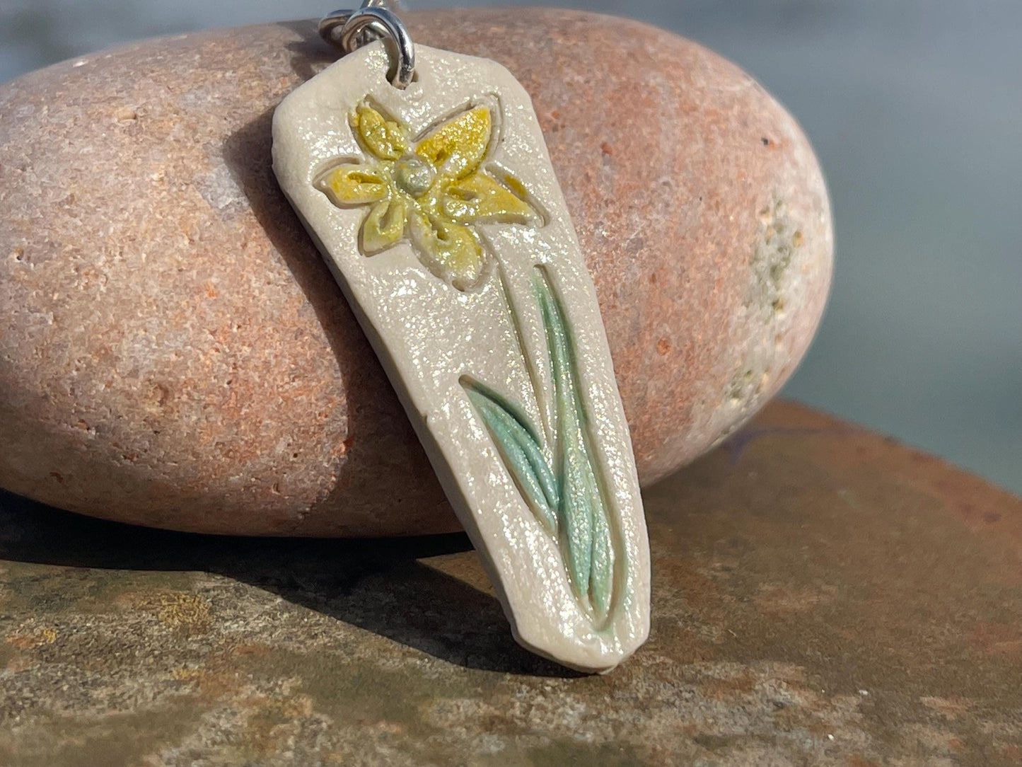 Handmade daffodil necklace. Eco friendly jewellery. Ethical pendants made with waste clay and recycled sterling silver. Ethical jewellery.