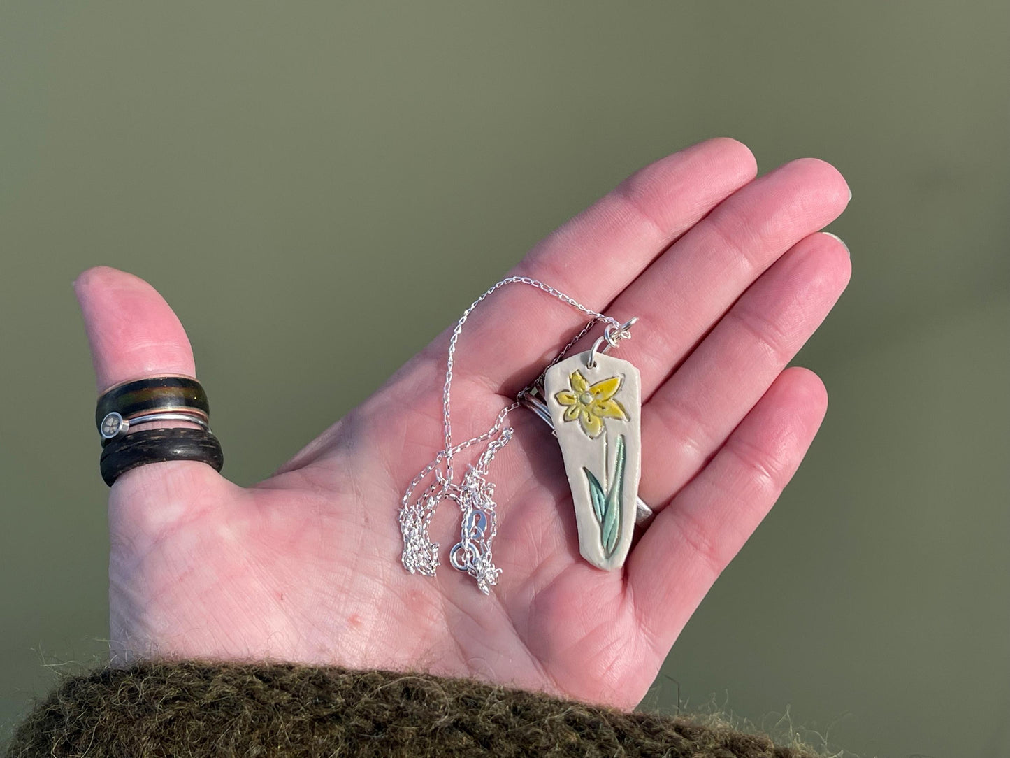 Handmade daffodil necklace. Eco friendly jewellery. Ethical pendants made with waste clay and recycled sterling silver. Ethical jewellery.