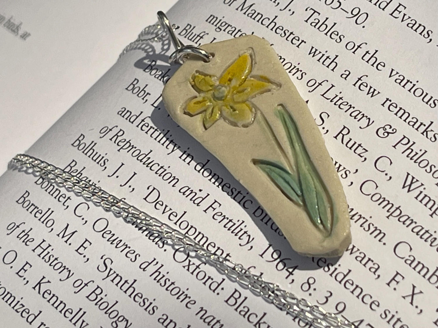 Handmade daffodil necklace. Eco friendly jewellery. Ethical pendants made with waste clay and recycled sterling silver. Ethical jewellery.