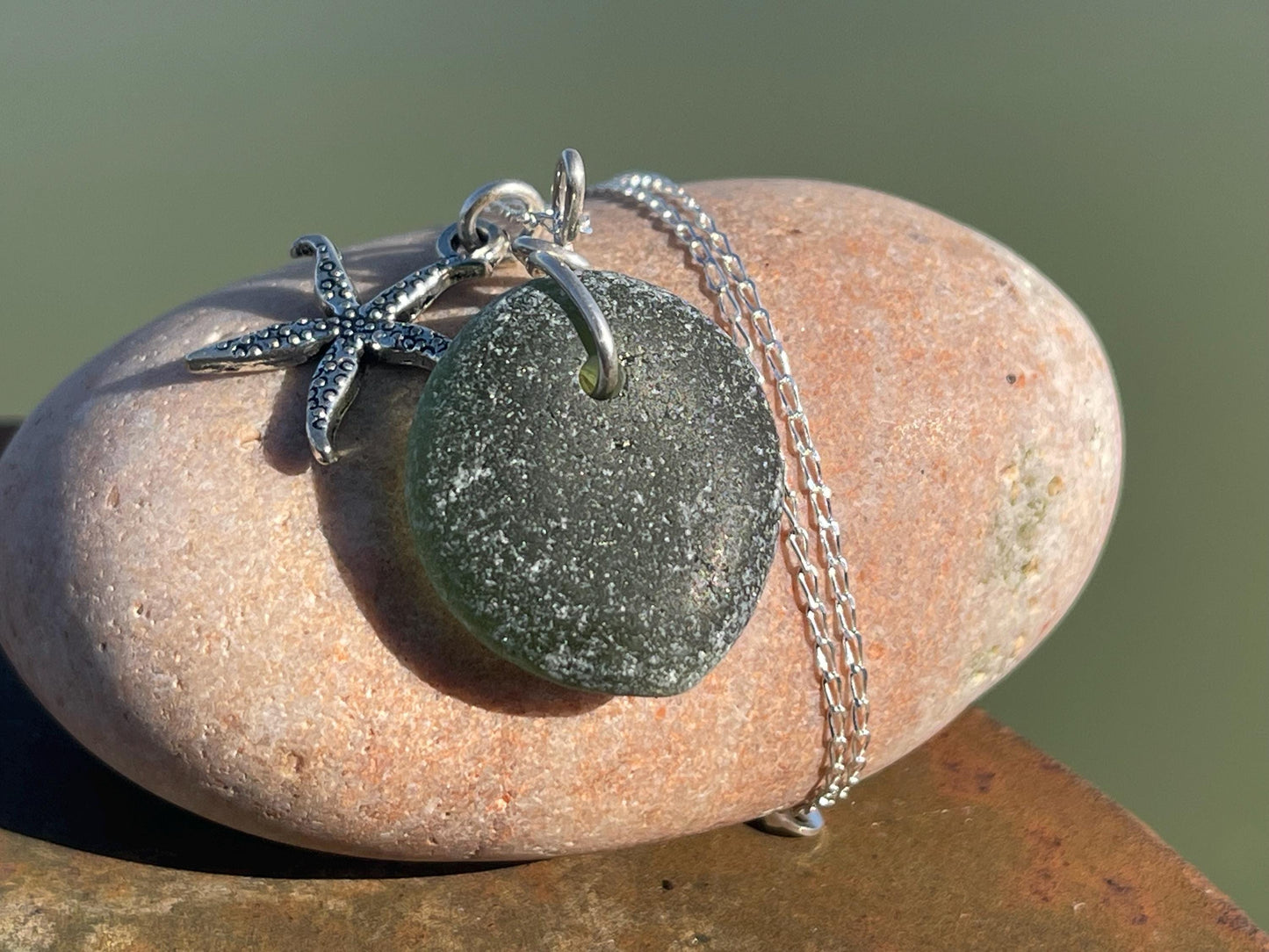 Eco friendly sea glass necklace on a sterling silver chain showcasing a little starfish. Starfish pendant,  eco friendly jewellery. Boho