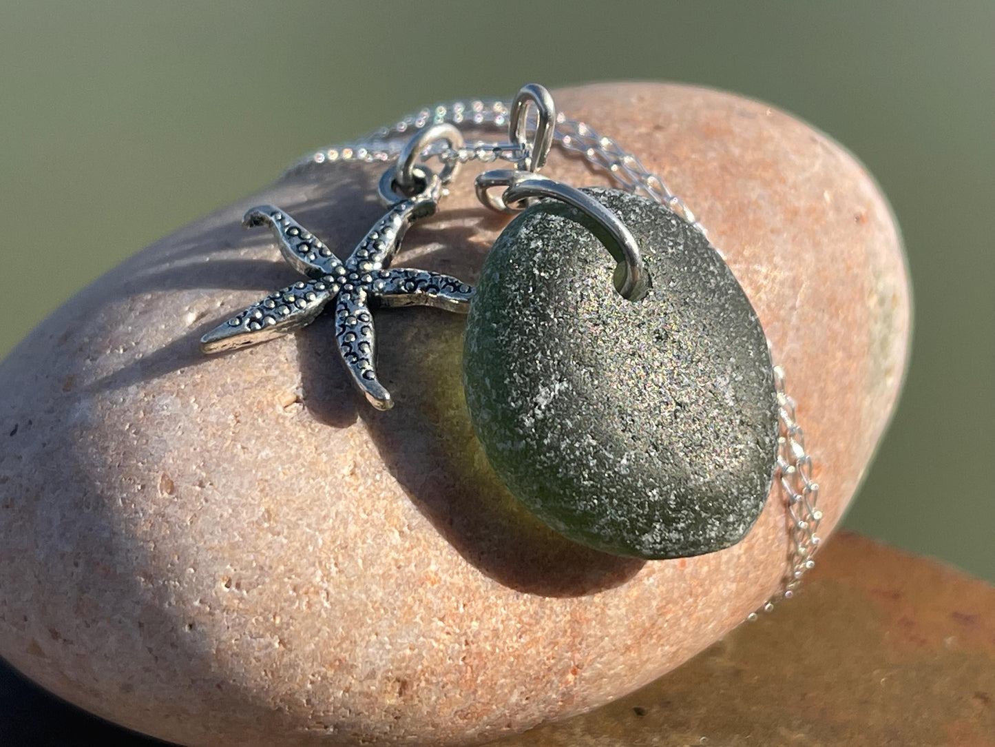 Eco friendly sea glass necklace on a sterling silver chain showcasing a little starfish. Starfish pendant,  eco friendly jewellery. Boho