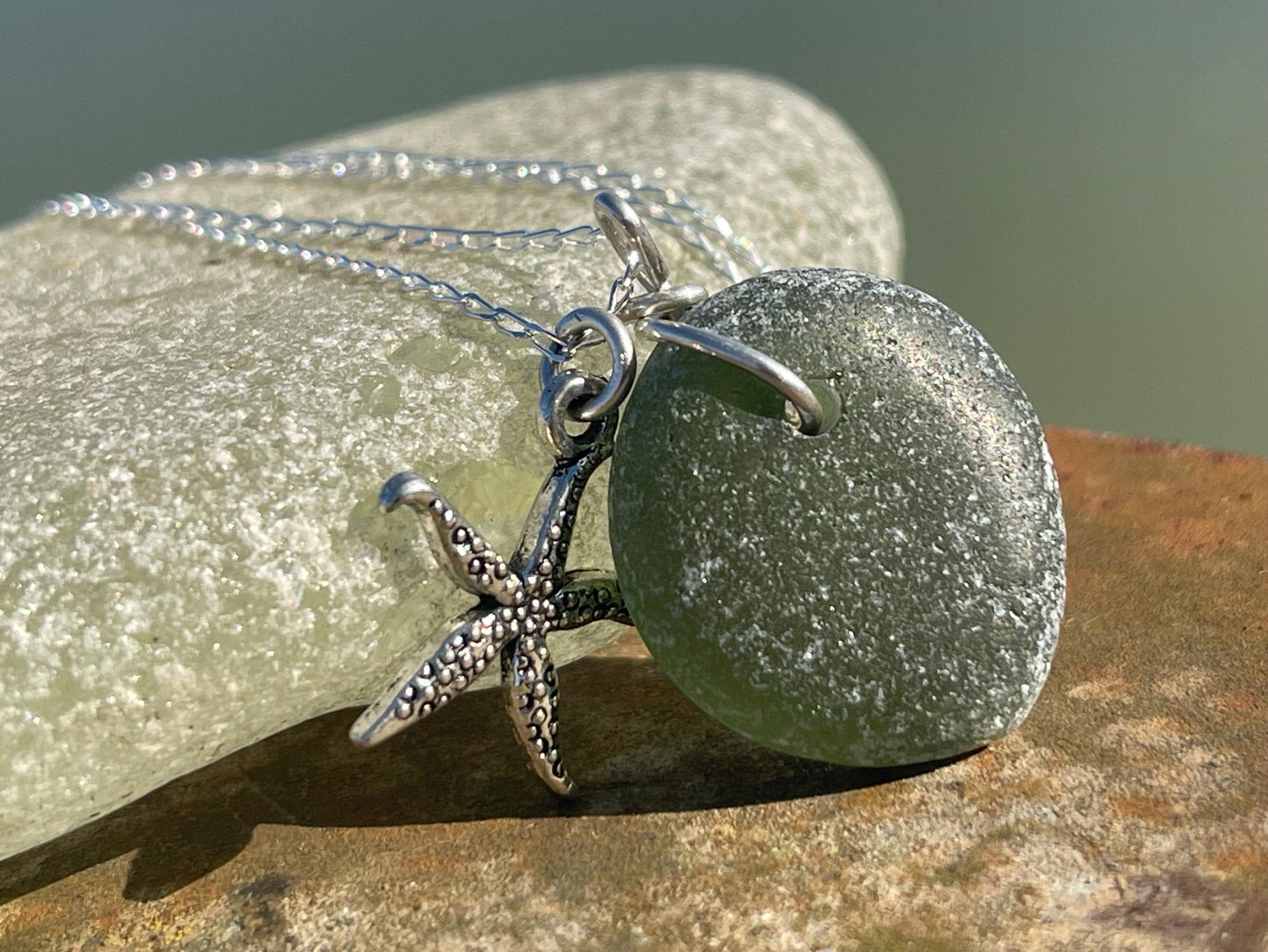 Eco friendly sea glass necklace on a sterling silver chain showcasing a little starfish. Starfish pendant,  eco friendly jewellery. Boho
