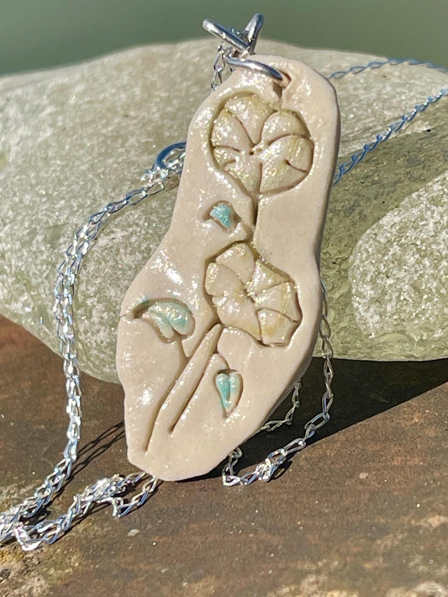 Handmade morning glory necklace. Eco friendly jewellery. Ethical pendants made with waste clay and recycled silver. Ethical jewellery.