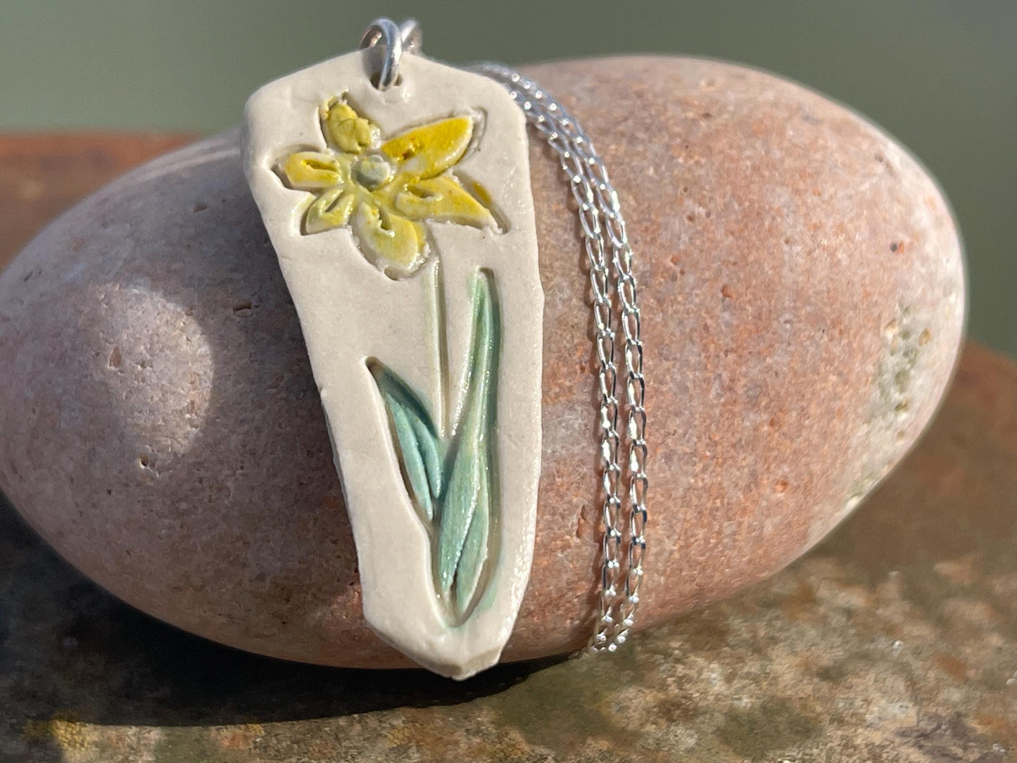 Handmade daffodil necklace. Eco friendly jewellery. Ethical pendants made with waste clay and recycled sterling silver. Ethical jewellery.