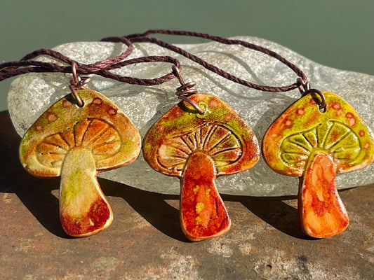 Handmade mushroom necklaces. Eco friendly jewellery. Ethical pendants made with waste clay and burnt recycled copper. Ethical jewellery.
