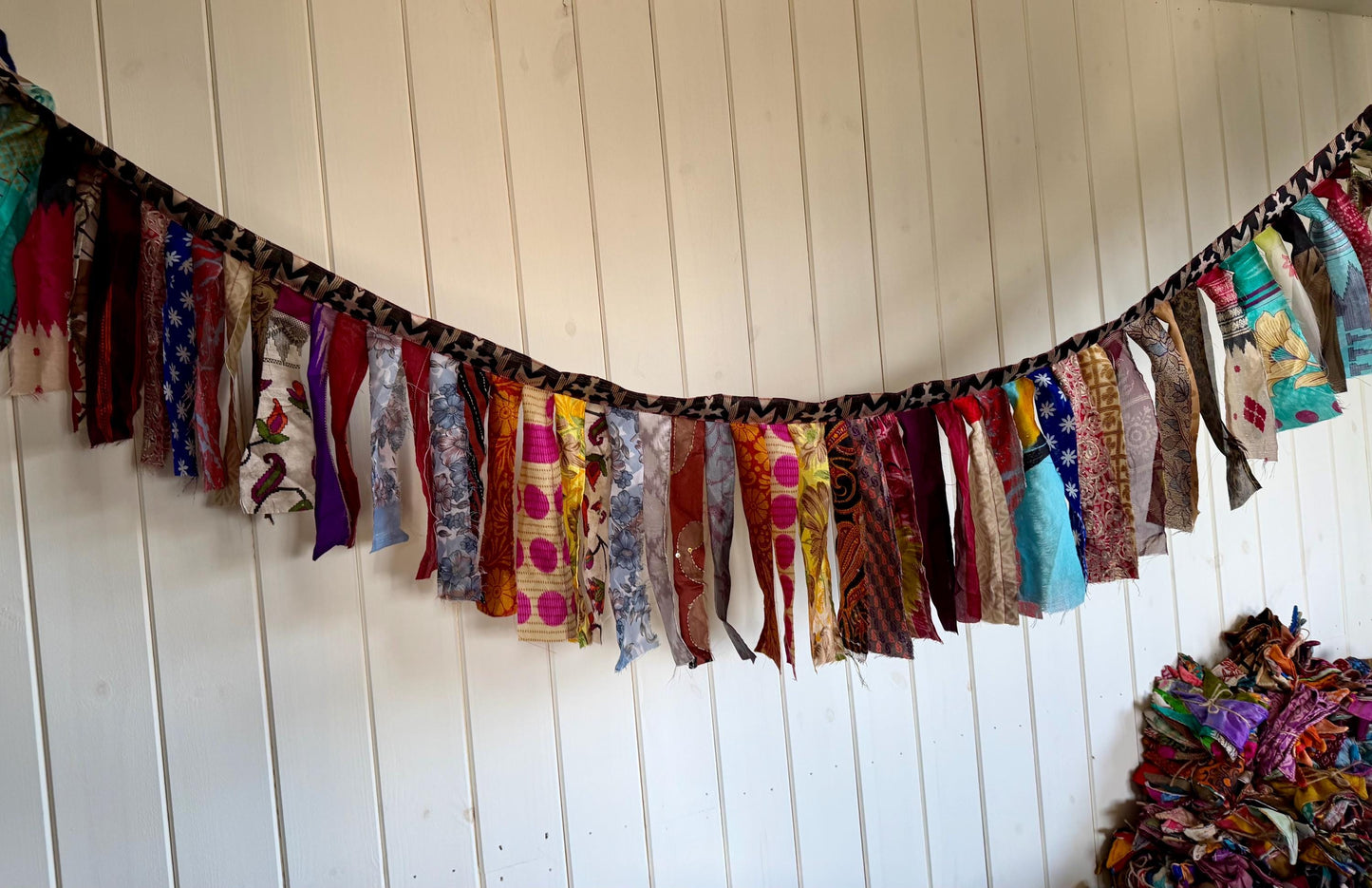 Long strips of multi-coloured rag bunting. Party bunting, wedding bunting, recycled sari bunting. Ideal for festivals, camping, birthdays