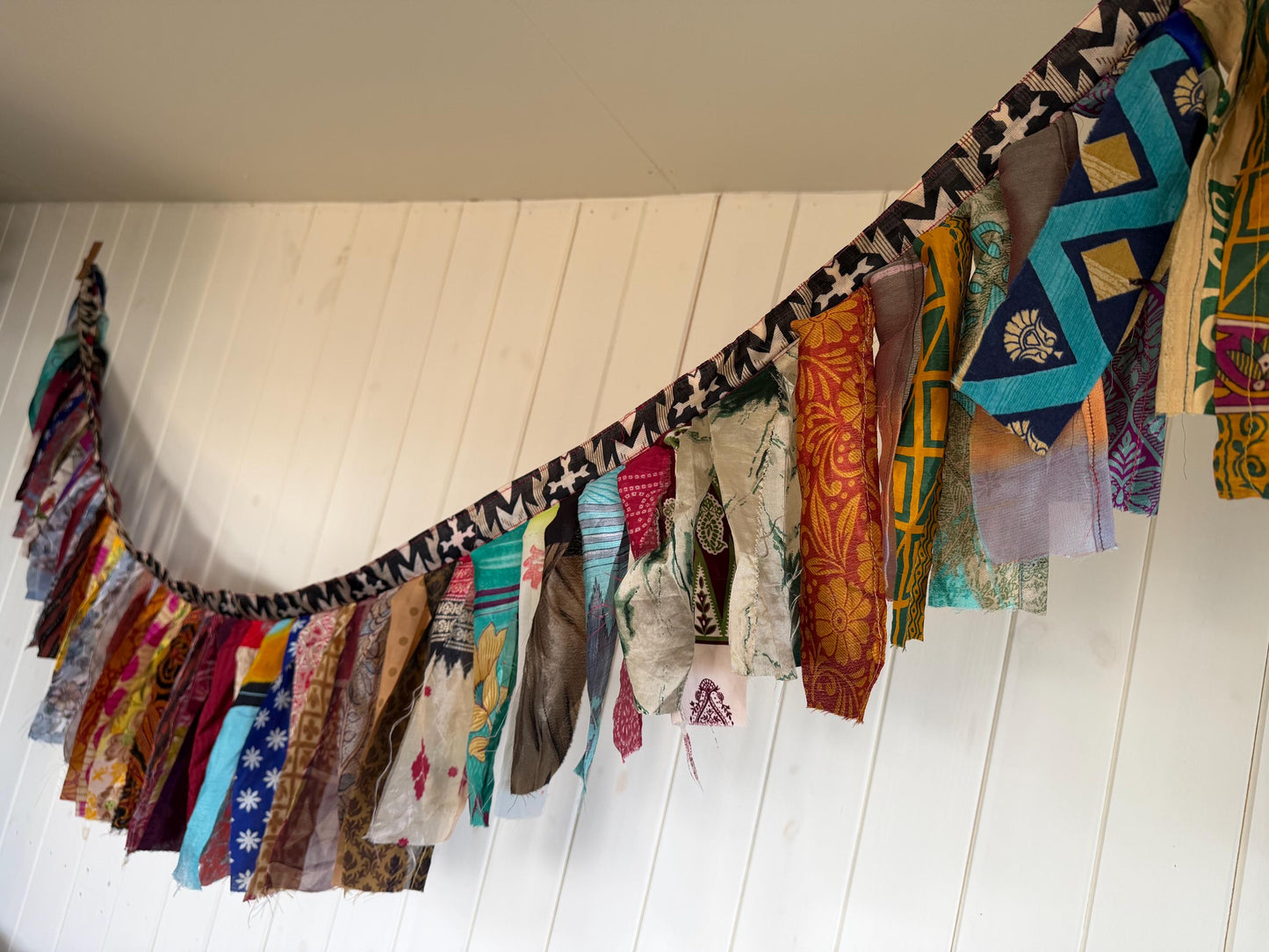 Long strips of multi-coloured rag bunting. Party bunting, wedding bunting, recycled sari bunting. Ideal for festivals, camping, birthdays