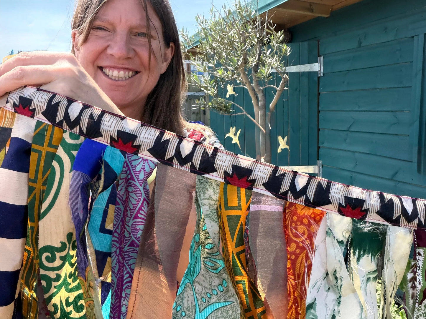 Long strips of multi-coloured rag bunting. Party bunting, wedding bunting, recycled sari bunting. Ideal for festivals, camping, birthdays