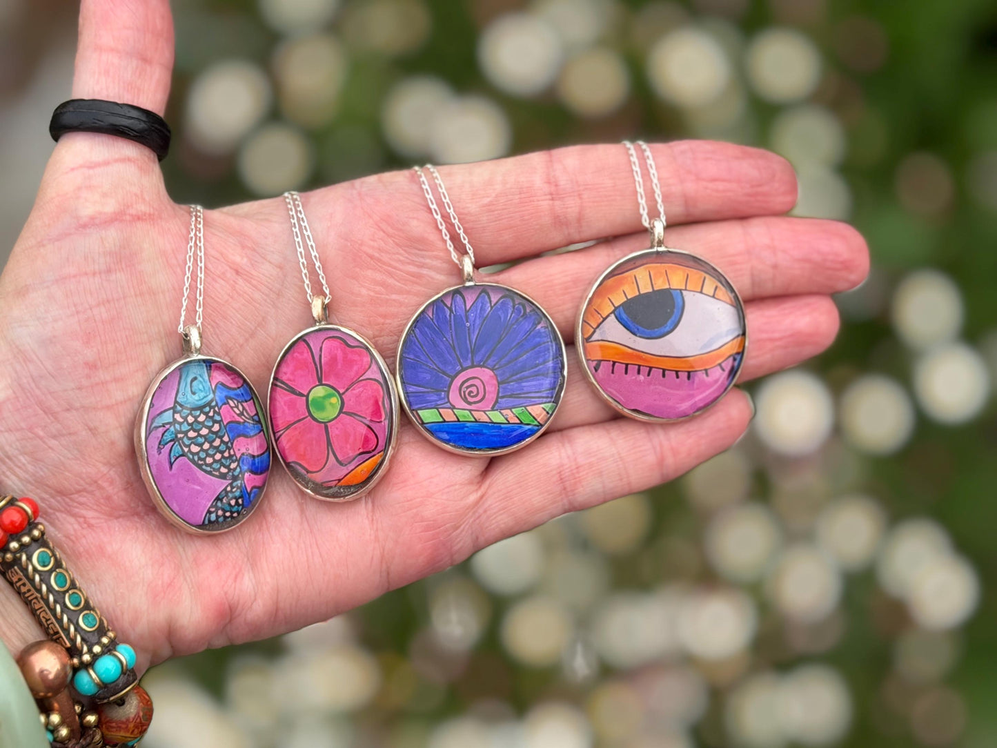 Bright joyful necklaces made with my own photos & recycled sterling silver. Eco friendly jewellery. Boho colourful pendants. Bright pink.