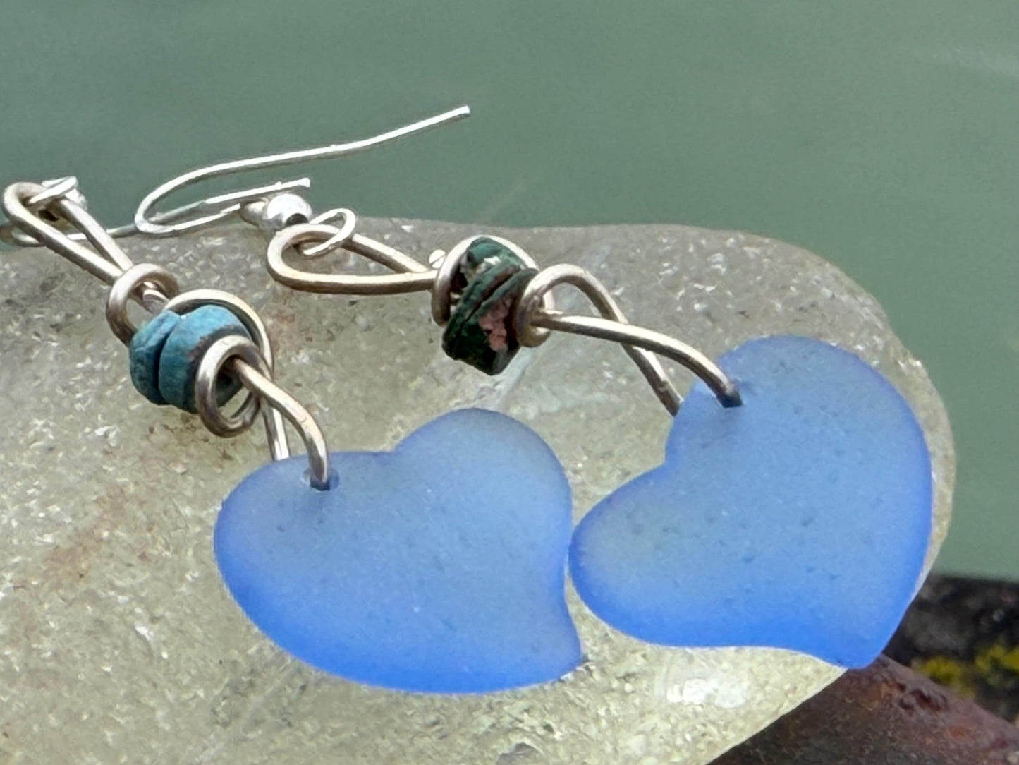 Blue glass heart earrings on recycled sterling silver. Eco conscious jewellery. Ethical jewellery. Blue glass hearts. Handmade earrings