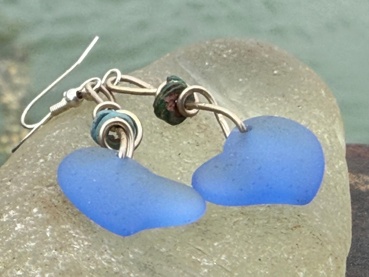 Blue glass heart earrings on recycled sterling silver. Eco conscious jewellery. Ethical jewellery. Blue glass hearts. Handmade earrings