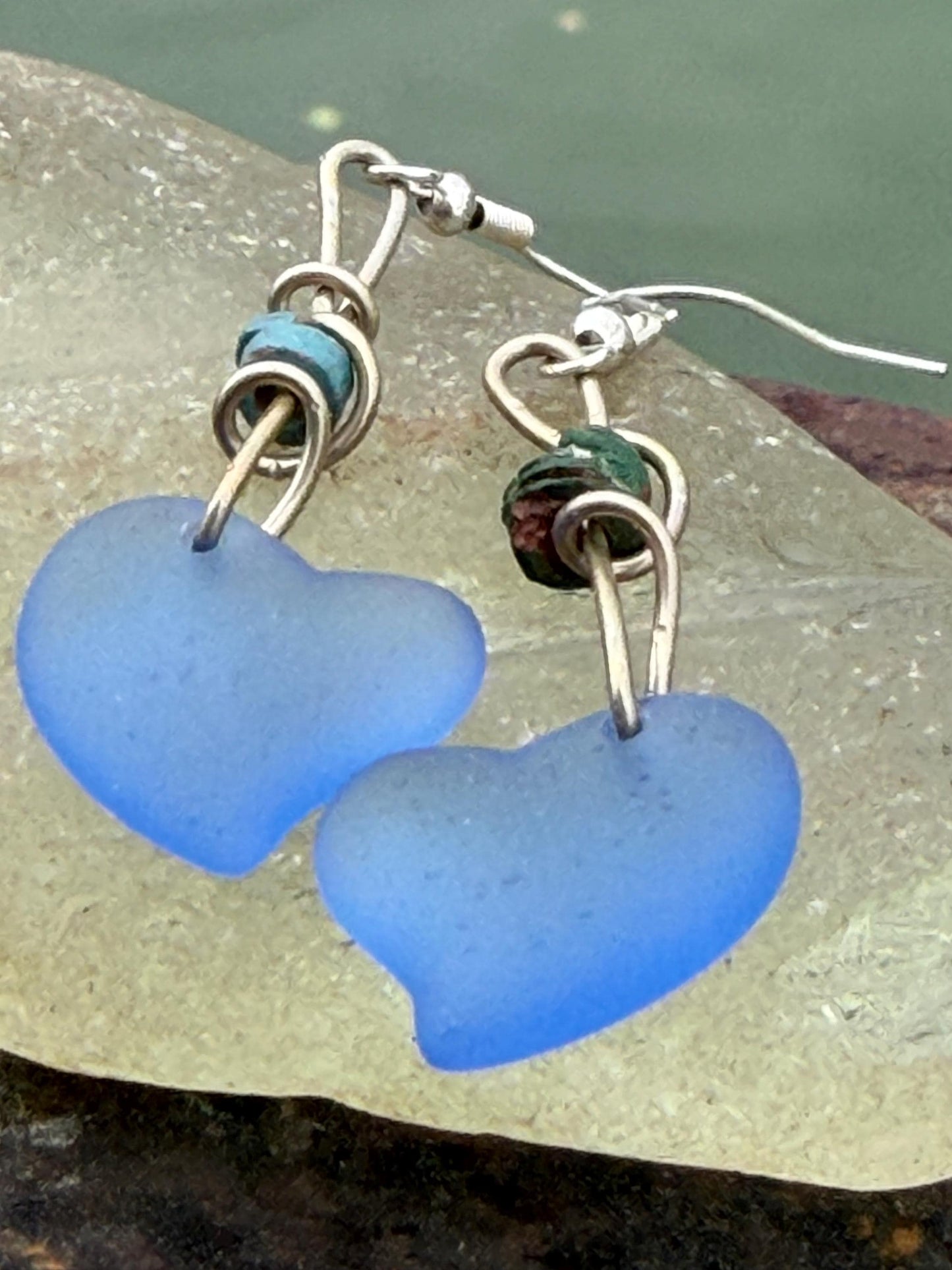 Blue glass heart earrings on recycled sterling silver. Eco conscious jewellery. Ethical jewellery. Blue glass hearts. Handmade earrings