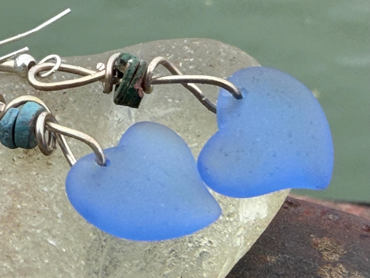Blue glass heart earrings on recycled sterling silver. Eco conscious jewellery. Ethical jewellery. Blue glass hearts. Handmade earrings